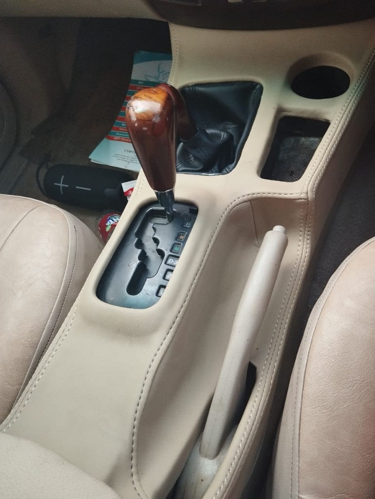 Beige faux-leather center console and seat trim upholstery by Bungoma Seatcovers Ventures