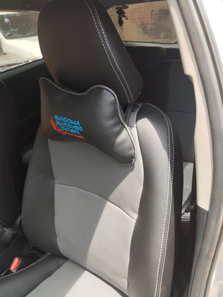 Grey and black custom seat cover with Bungoma Seatcovers Ventures branded neck pillow