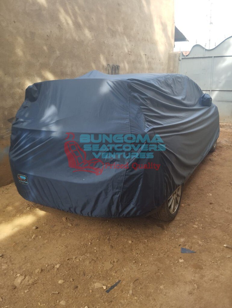 Custom navy blue full car body cover tailored by Bungoma Seatcovers Ventures